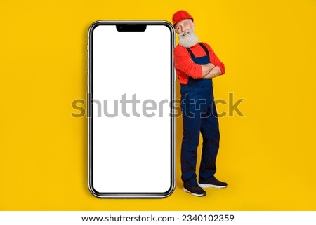 Photo of artisan architect workman advertise reconstruction service smart phone poster isolated on shine color background