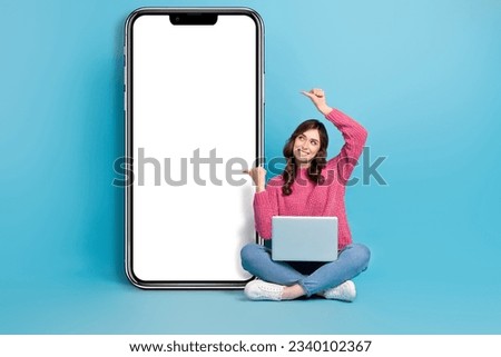 Full body length photo of young promoter direct fingers online website computer gadget shopping remote app amazon isolated on blue color background