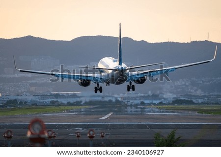 
A photo of an airplane landing at Itami Airport, the major airport in the Kansai region of Japan.