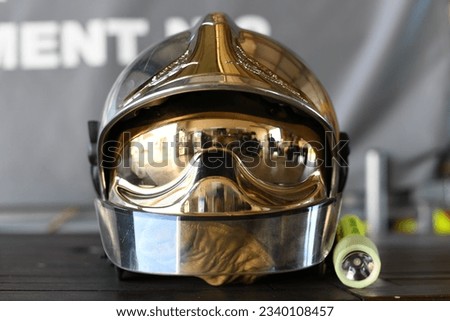 Fire department. Firefighter helmet, protective equipment against heat, flash light. Symbol of brave men and women.