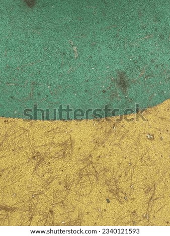 Yellow green dirty floor under toy equipment