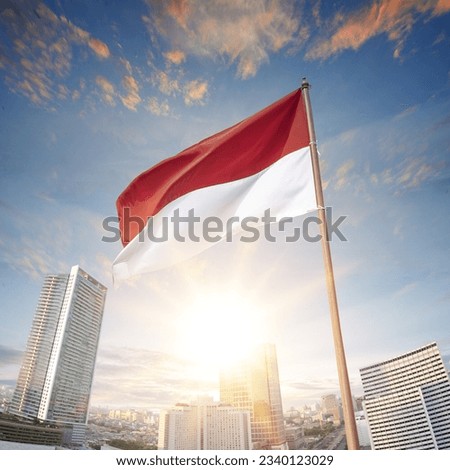 The red and white flag of Indonesian flag with blue sky background