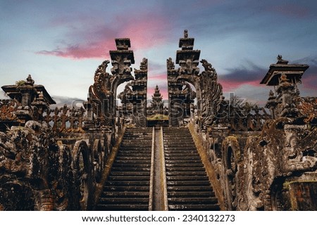 Landscape view of sacred Besakih temple with sunset sky background. Stone ladder to holy religious praying place Royalty-Free Stock Photo #2340132273