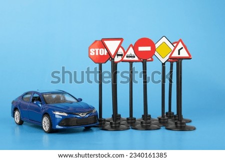 traffic laws, road rules and regulations, car insurance and claims, car and road signs on a blue background