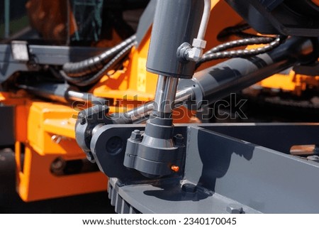Hydraulic mechanisms of agricultural machinery and equipment.  Royalty-Free Stock Photo #2340170045