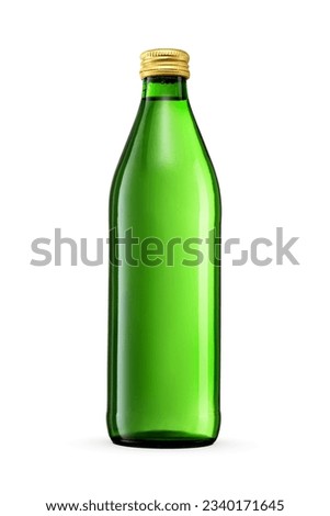 Green glass bottle of soda or mineral water isolated on white background. Closed with golden metal twist off screw cap. Royalty-Free Stock Photo #2340171645