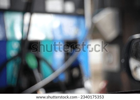 Blur focus of  of petroleum gasoline station service - oil refueling and refilling for car transportation concept