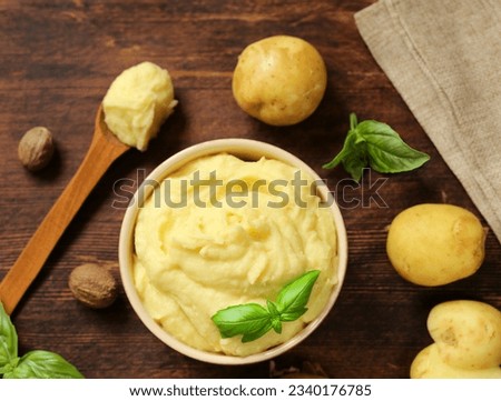 mashed potatoes in a wooden bowl on the table Royalty-Free Stock Photo #2340176785