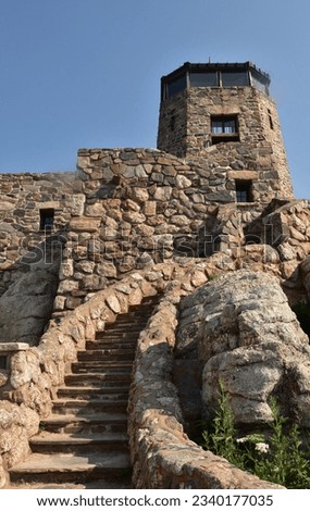 Stone observation and watch tower on top of Harney Peak in Custer State Park. Royalty-Free Stock Photo #2340177035
