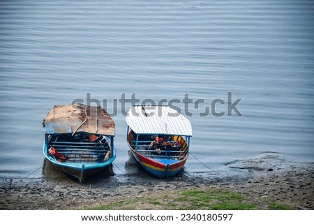 Wooden boat by the lake with anime background.