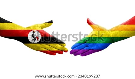 Handshake between LGBT and Uganda flags painted on hands, isolated transparent image.