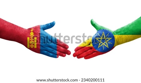 Handshake between Ethiopia and Mongolia flags painted on hands, isolated transparent image.