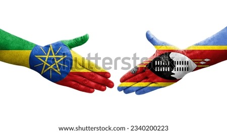 Handshake between Eswatini and Ethiopia flags painted on hands, isolated transparent image.