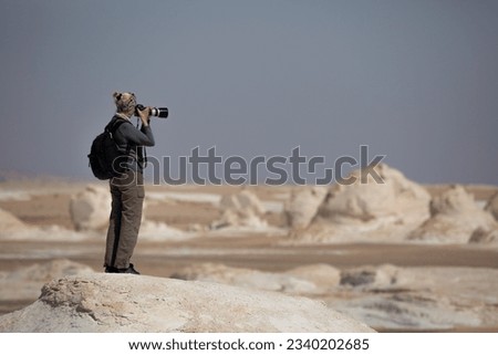 Professional landscape photographer photographing the desert panorama