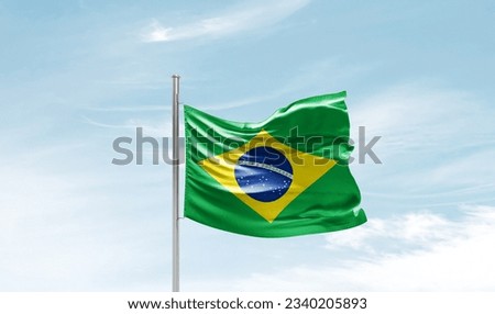Brazil national flag waving in beautiful sky. Royalty-Free Stock Photo #2340205893