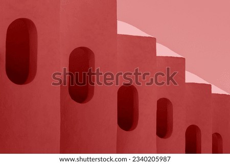 Abstract architecture details concrete facade curve pattern. Exterior walls buildings with curved windows. Intense red colored. Modern and organic lines. Contemporay design elements. polished lines 
