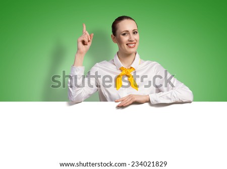 Young pretty woman with white blank banner on color background