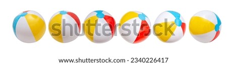 Beach balls in a row isolated on white background, Summer vacations by the sea, kids fun