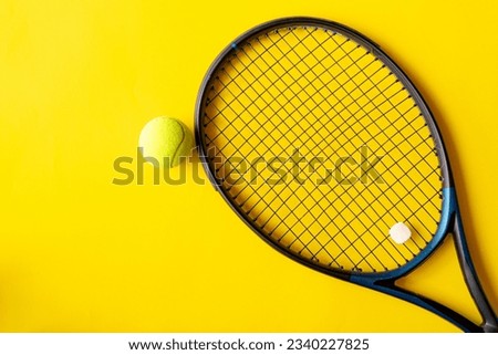 Tennis racket and tennis ball on yellow background, Top view of  ,Top view with copy space for text Royalty-Free Stock Photo #2340227825