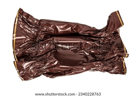 Blank empty crumpled brown candy wrapper isolated on white background Royalty-Free Stock Photo #2340228763