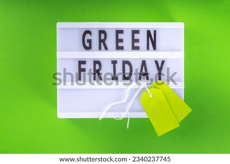 Green Friday concept with green sale and discounts tag, conscious and environmentally friendly shopping idea, useful things on sale instead of the usual Black Friday Sale. Eco friendly lifestyle