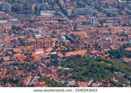 The cityscape of Pécs. Downtown with Széchenyi square and the Dzsámi. Aerial shot.