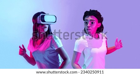 Virtual Gaming Adventure. Young Woman Engaging with 3D Avatar in Metaverse, Wearing VR Glasses And Playing Online Game With Augmented Reality, Posing On Purple Studio Background, Panorama