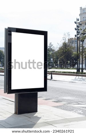 Vertical billboard for advertising and text in the city. Deserted space. Mock-up. Royalty-Free Stock Photo #2340261921
