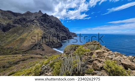 Panoramic view of Atlantic Ocean coastline and Anaga mountain range on Tenerife, Canary Islands, Spain, Europe, EU. Path to beach Playa del Tamadite. Scenic coastal hiking trail from Afur to Taganana Royalty-Free Stock Photo #2340262975