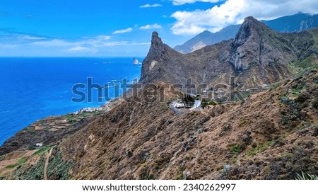 Scenic view of Atlantic Ocean coastline and Anaga mountain range on Tenerife, Canary Islands, Spain, Europe. Looking at Roque de las Animas crag and Roque en Medio. Hiking trail from Afur to Taganana Royalty-Free Stock Photo #2340262997