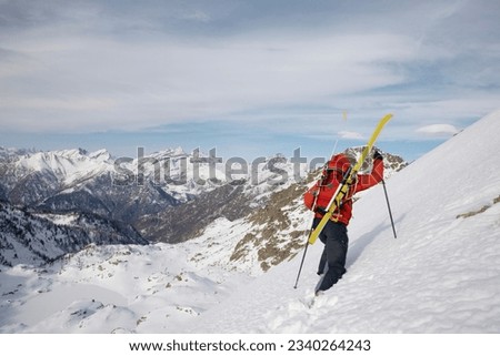 Winter mountaineering in wilderness area- male climber, exploring and adventure concept.