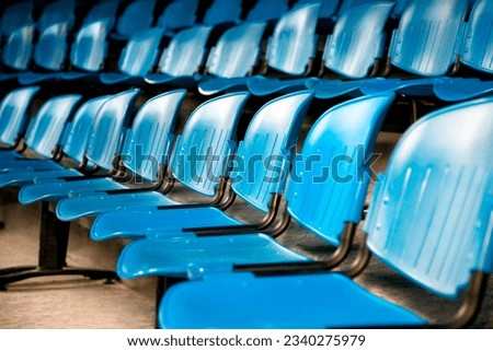 the show- rows of blue plastic chairs