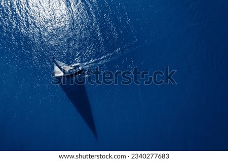 Sail boat sailing on a blue ocean. Royalty-Free Stock Photo #2340277683