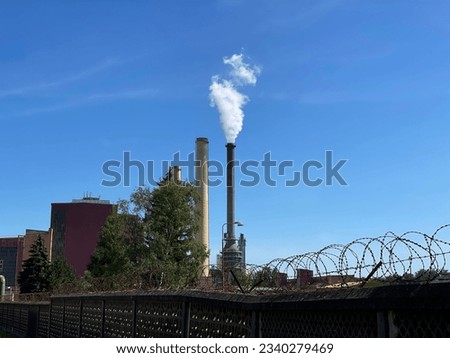 Coal power plant with high chimneys at local Tisová nearby Sokolov town in the Czech Republic. Emissions of CO2 and nitrogen oxides cause greenhouse effect and global warming with drought and floods. Royalty-Free Stock Photo #2340279469