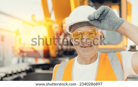 Portrait happy Engineer Man professional background yellow big truck excavator on building construction site. Concept industry worker banner.