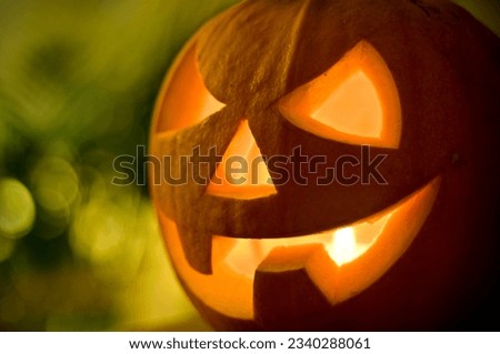 A candle lit halloween pumpkin.