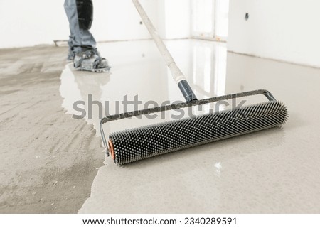New screed concrete with mixture of cement for leveling for floors. Royalty-Free Stock Photo #2340289591