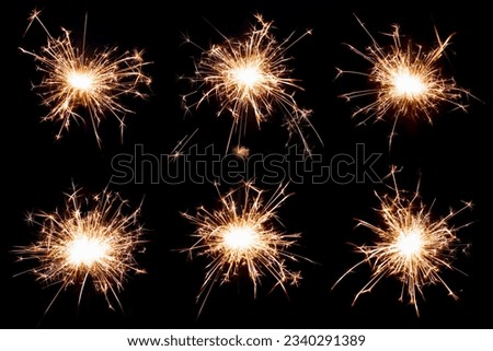 Set of Bengal lights on a black isolated background. Sparks from burning Bengal lights. To insert an image in overlay mode Royalty-Free Stock Photo #2340291389