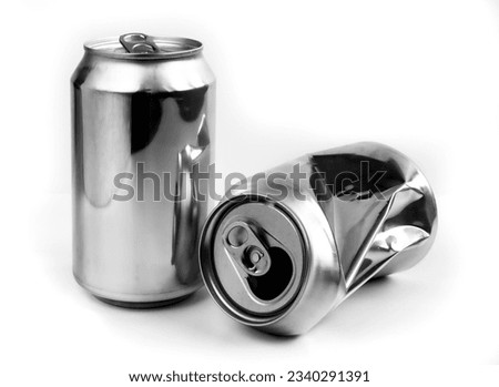 Two aluminum crushed cans for beverage. Still-life picture of some metallic containers isolated on white background. Royalty-Free Stock Photo #2340291391