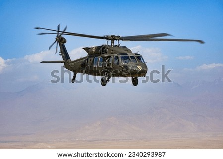 UH-60M Blackhawk army helicopter desert flight Royalty-Free Stock Photo #2340293987