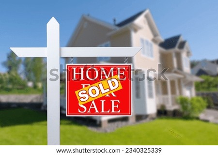 Sold Home For Sale Real Estate Sign in Front of Beautiful New House