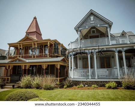 Beautiful colourful gingerbread houses, cottages in Oak Bluffs center, Martha's Vineyard island in Massachusetts USA on a sunny summer day Royalty-Free Stock Photo #2340344455