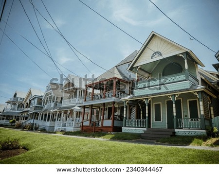 Beautiful colourful gingerbread houses, cottages in Oak Bluffs center, Martha's Vineyard island in Massachusetts USA on a sunny summer day Royalty-Free Stock Photo #2340344467
