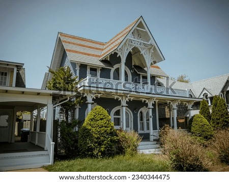 Beautiful colourful gingerbread houses, cottages in Oak Bluffs center, Martha's Vineyard island in Massachusetts USA on a sunny summer day Royalty-Free Stock Photo #2340344475