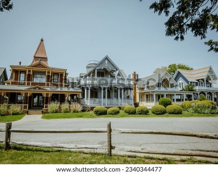 Beautiful colourful gingerbread houses, cottages in Oak Bluffs center, Martha's Vineyard island in Massachusetts USA on a sunny summer day Royalty-Free Stock Photo #2340344477