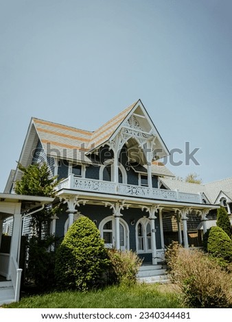 Beautiful colourful gingerbread houses, cottages in Oak Bluffs center, Martha's Vineyard island in Massachusetts USA on a sunny summer day Royalty-Free Stock Photo #2340344481