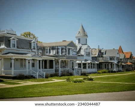 Beautiful colourful gingerbread houses, cottages in Oak Bluffs center, Martha's Vineyard island in Massachusetts USA on a sunny summer day Royalty-Free Stock Photo #2340344487