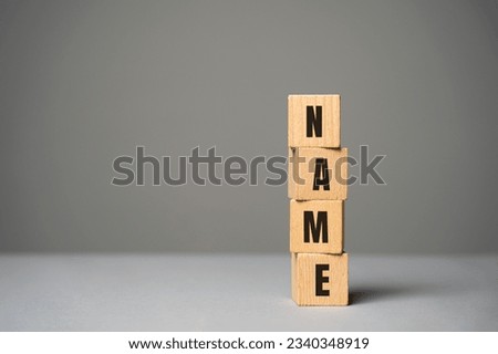 Name inscription on wooden blocks concept. Creation of a new personal brand or name for a business company. Logo, marketing. Product or idea names. Copy space Royalty-Free Stock Photo #2340348919