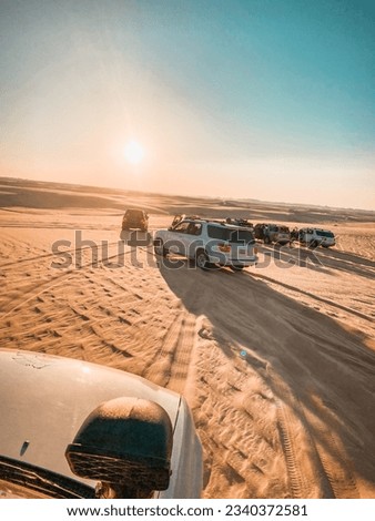 Beautiful sunset view and safari with four wheel drive car Royalty-Free Stock Photo #2340372581