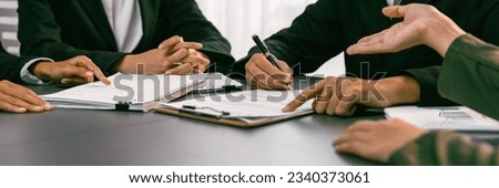 Panorama view of company executive sign business contract with business partner and legal adviser in corporate meeting table. Business people negotiating agreement in conference room concept. Prodigy Royalty-Free Stock Photo #2340373061